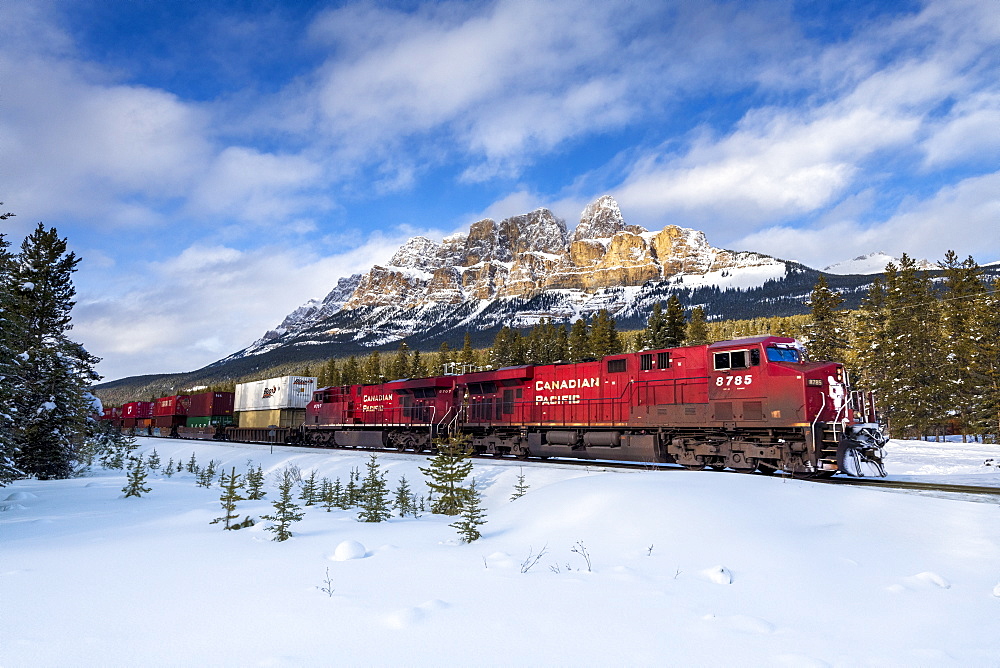 Canadian locomotive passing Castle Mountain in winter, near Banff, Alberta, Canadian Rockies, Canada, North America