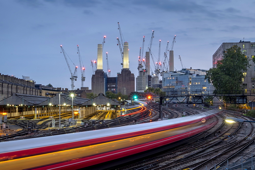 Long exposure of passenger train travelling towards Battersea Power Station, London, England, United Kingdom, Europe