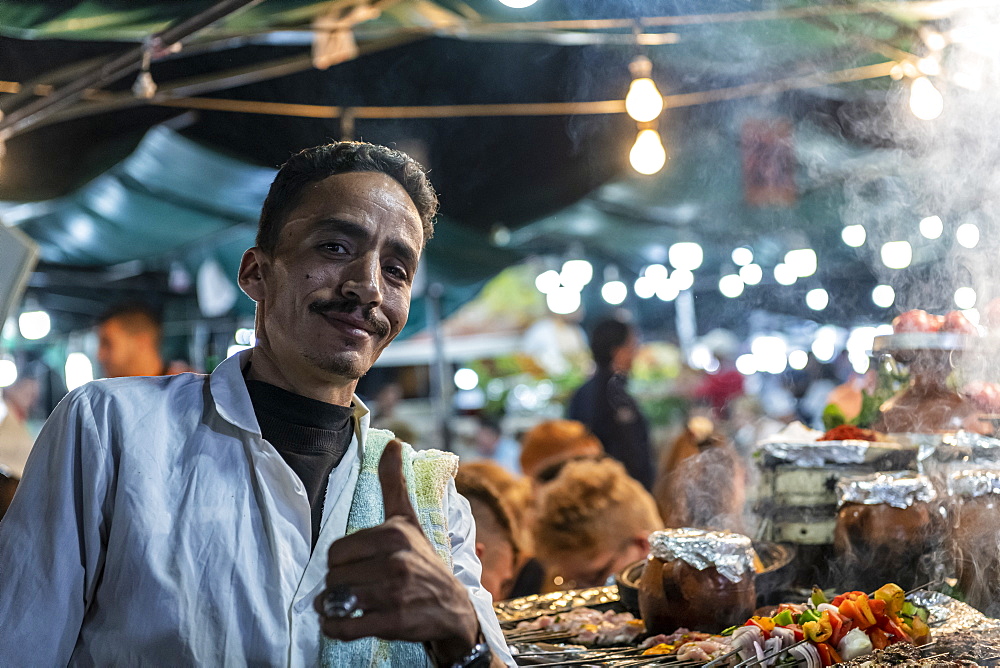 Market stall worker and chefs cooking, Djemaa El Fna Square, Marrakesh, Morocco, North Africa, Africa