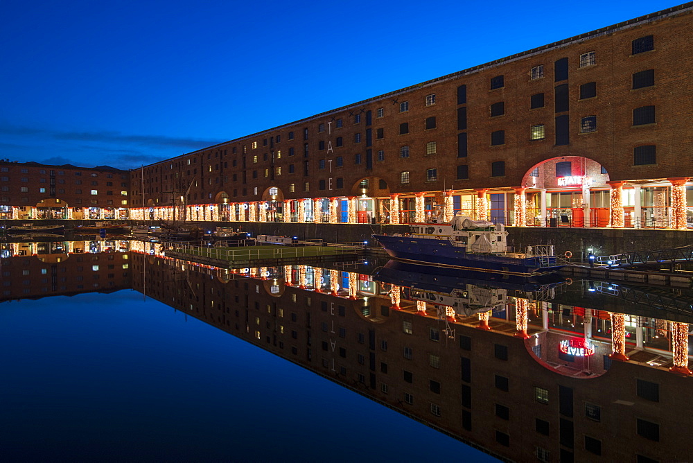 Reflected view at Christmas of The Royal Albert Dock and Tate Museum, Liverpool, Merseyside, England, United Kingdom, Europe