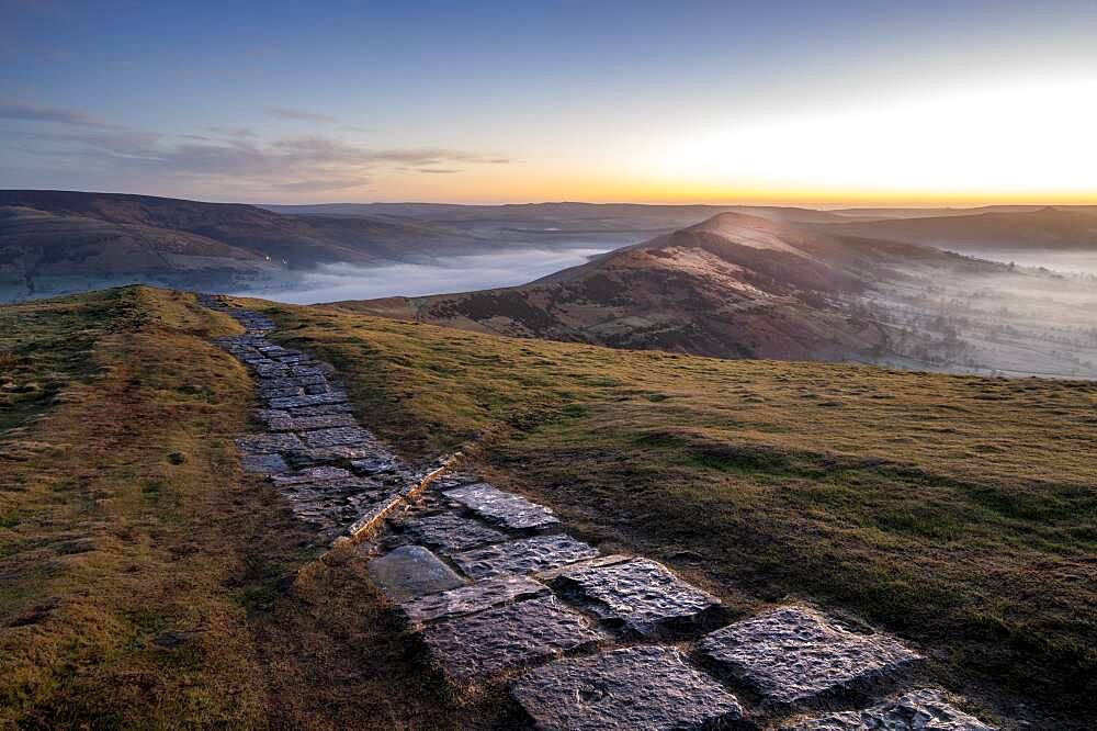 The path at Mam Tor leading to Losehill at sunrise, Peak District, Derbyshire, England, United Kingdom, Europe