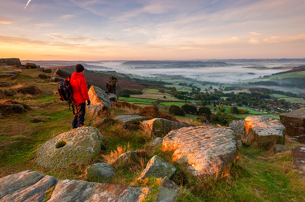 Male walker standing on Curbar Edge, Peak District, Derbyshire, England, United Kingdom, Europe