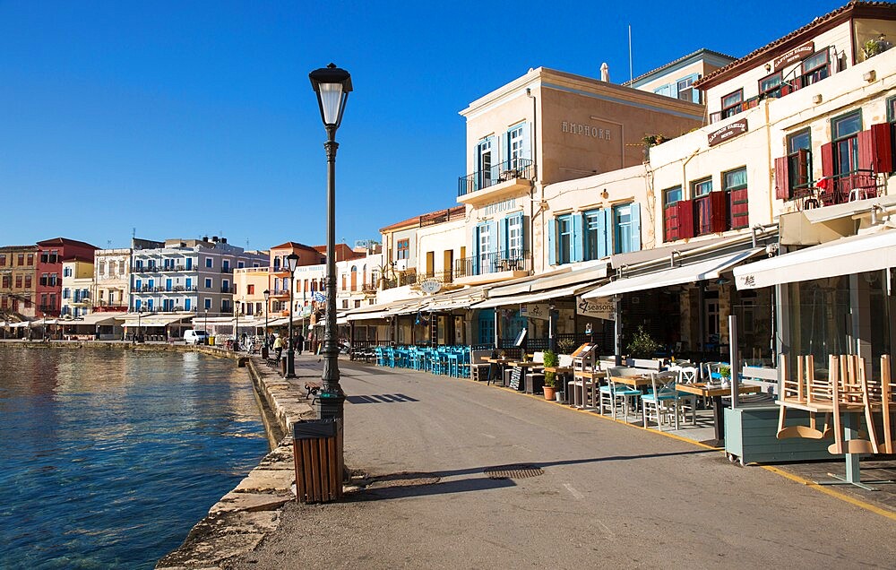 Colourful waterfront cafes beside the Venetian Harbour, Hania (Chania), Crete, Greek Islands, Greece, Europe