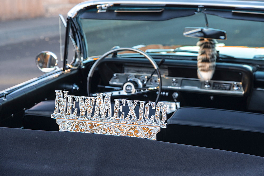 Detail of a shiny New Mexico sign affixed to a vintage car, in Old town, Albuquerque, New Mexico, United States of America, North America