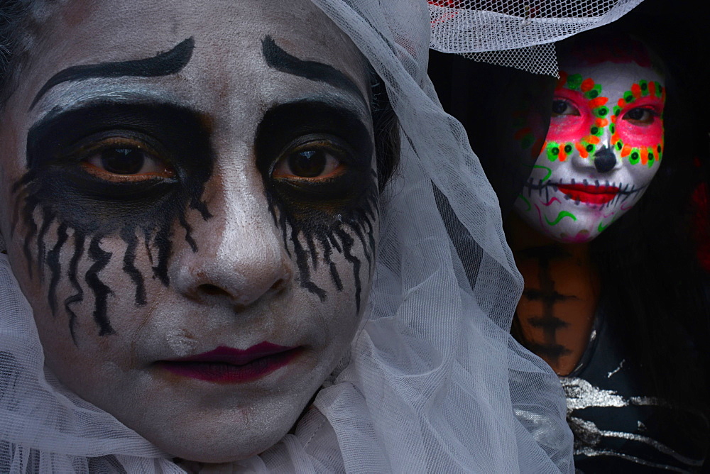 People in costume participating in comparsas (street dances) during the Day of The Dead Celebration, Oaxaca City, Oaxaca, Mexico, North America