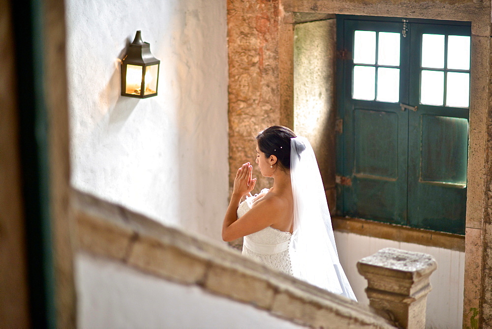 Hispanic bride getting ready on her wedding day