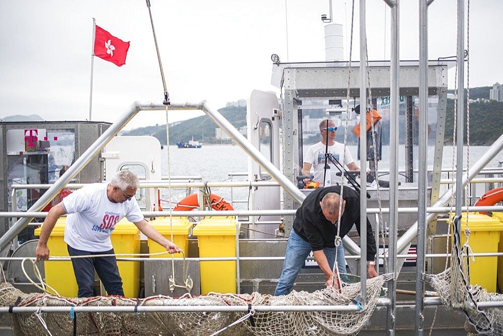 Seekuh on an Ocean clean up run by the charity One Earth One Ocean, Hong Kong, China