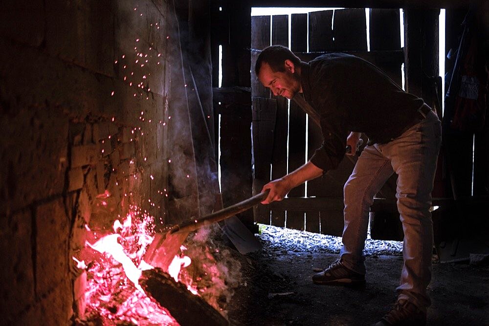 Firing up the Kiln at a Marginea Black Pottery and Ceramics workshop, Bukovina, Romania