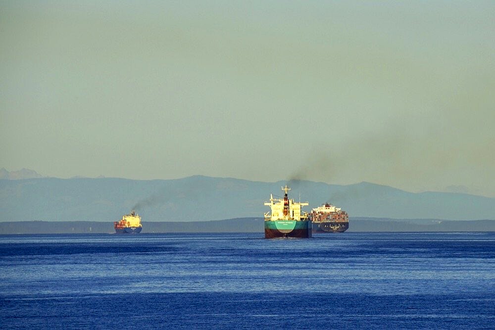 Victoria, British Columbia, Canada Three ships leaving port and heading out on the Strait of Juan de Fuca