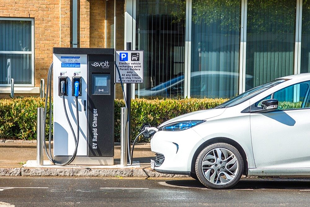 Electric car plugged into Evolt charge point in Cambridge, England, UK