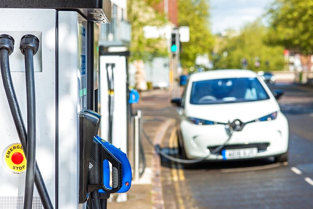 Electric car plugged into Evolt charge point in Cambridge, England, UK