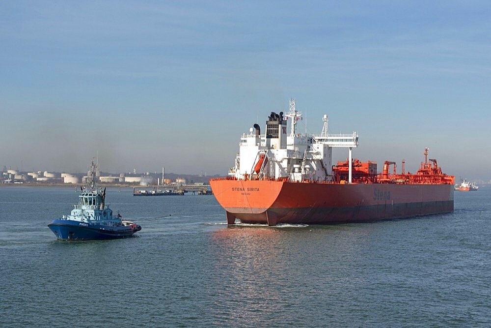 Fawley, Southampton, England UK 14 , The Stena Sarita a crude oil tanker with tug Phoenix and stern line attached Maneuvering into a berth at Fawley oil terminal