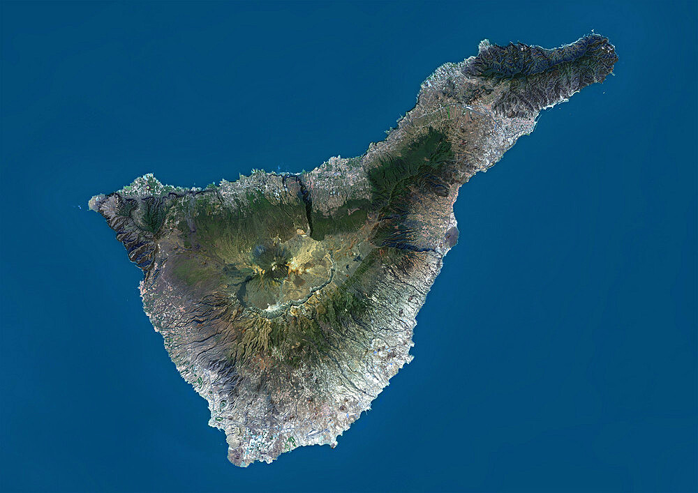 Satellite view of Tenerife, Canary Islands, Spain. It is the largest and most populous island of the seven Canary Islands. Volcano Mount Teide at center is the highest point of Spain, at 3718 m. This image was compiled from data acquired by Landsat 8 satellite in 2014.