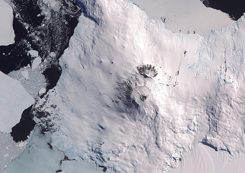 Satellite view of Mount Erebus, the tallest volcano in Antarctica. Situated on Ross Island, just off the coast of West Antarctica, Erebus is the southernmost active volcano on Earth. This image was taken on December 31, 2013 by Landsat 8 satellite.