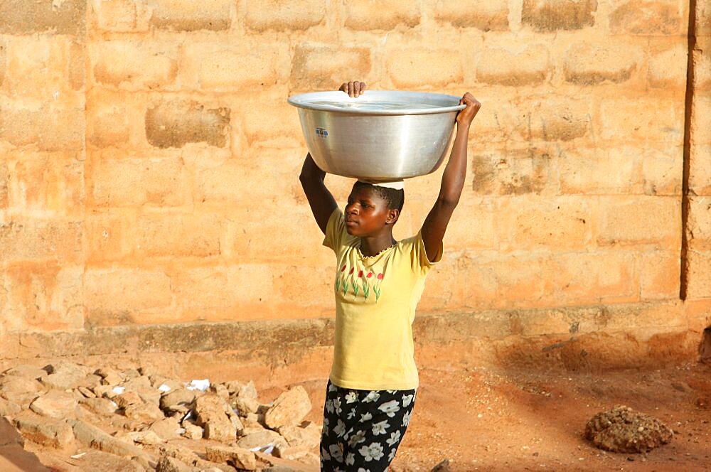 Woman carrying water.