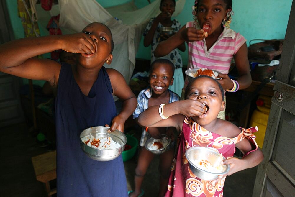 Children eating an african meal.