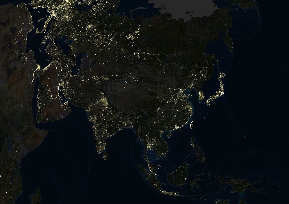 Asia At Night, True Colour Satellite Image. True colour satellite image of Asia at night. This image in Lambert Azimuthal Equal Area projection was compiled from data acquired by LANDSAT 5 & 7 satellites.