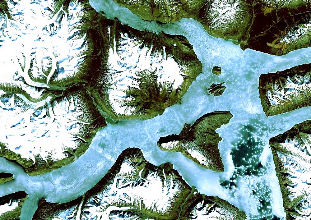 King Oscar Fjord, Greenland, True Colour Satellite Image. King Oscar Fjord located in Greenland National Park. The pastel blue indicates that the water has turned into ice. Image taken on 21 June 1991 using LANDSAT data.