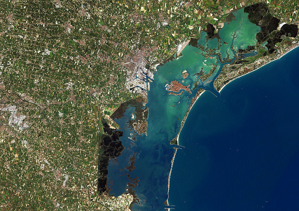 Venice, Italy, True Colour Satellite Image. Venice, France. True colour satellite image of the city of Venice that stretches across numerous small islands in the marshy Venetian Lagoon. Image taken on 26 August 2001 using LANDSAT 7 data.