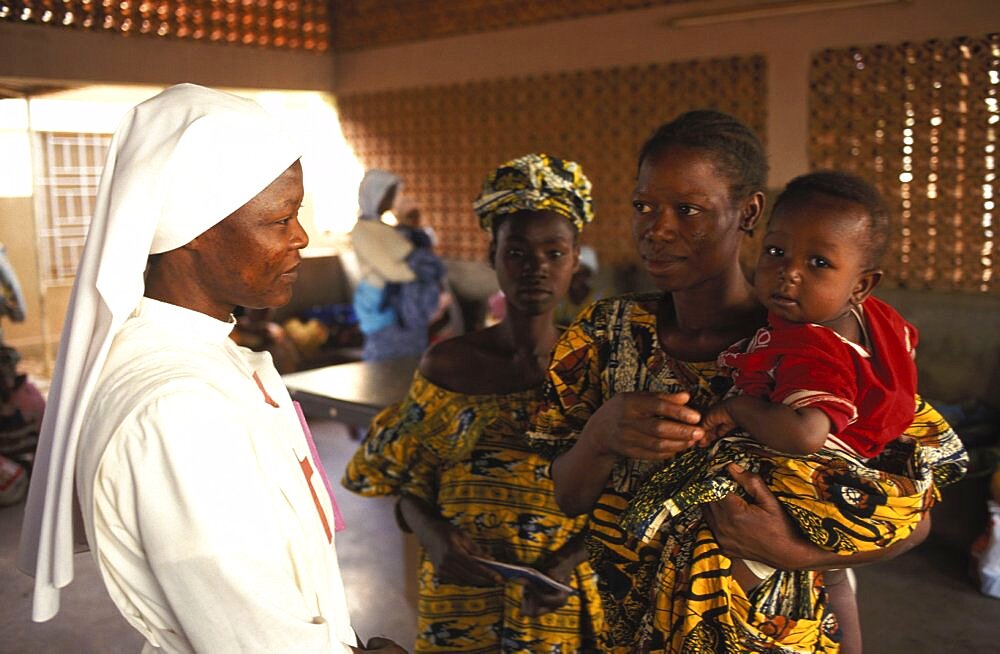 Burkina Faso, Ouagadougou, Mother with child in hospital