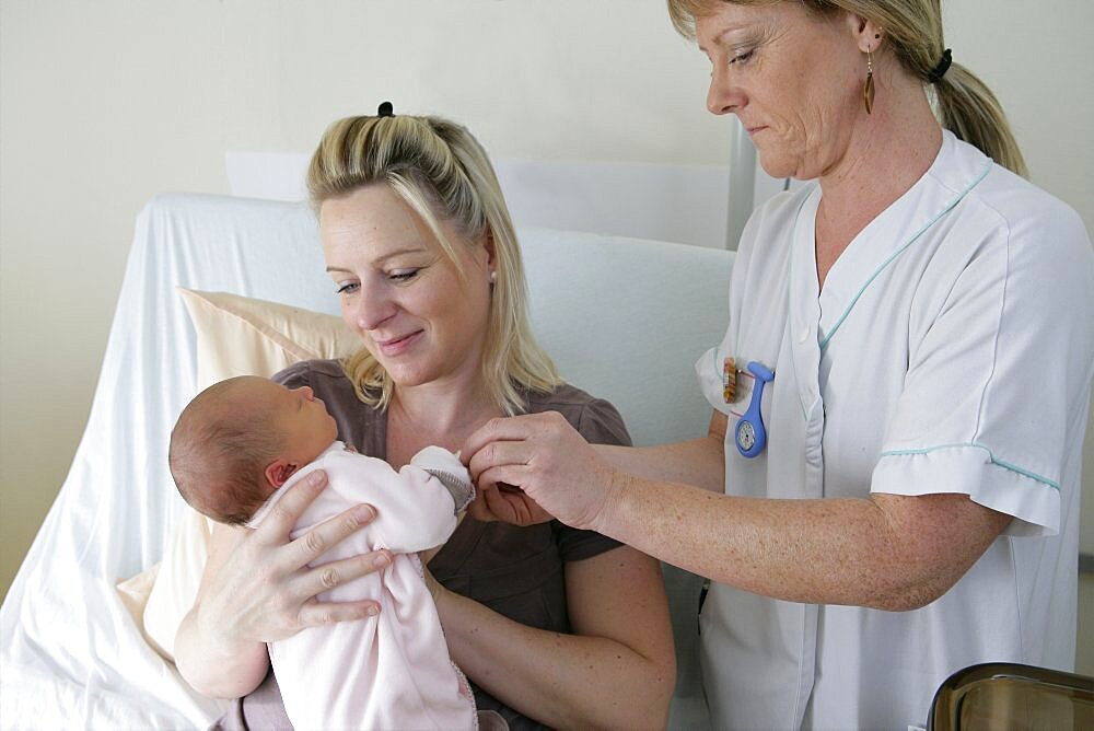 Maternity Ward, Nurse Instructing New Mother