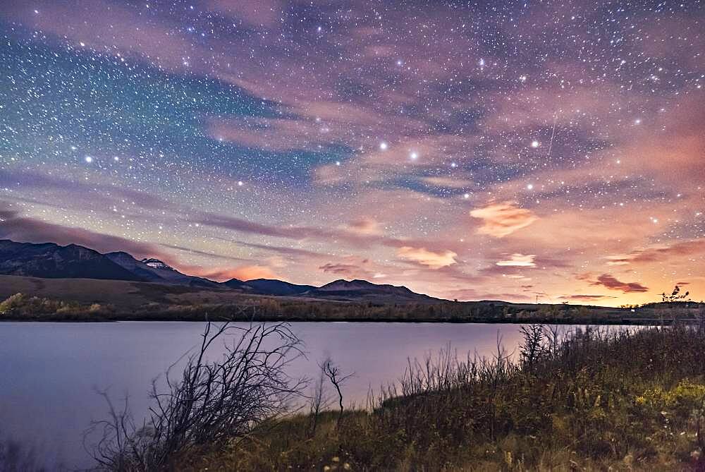 The Big Dipper in hazy clouds over the Waterton River at Maskinonge Pond, September 23, 2016, taken at the Night Photography Workshop I conducted there that night. The glow at right is light pollution from the Shell Waterton Gas Plant and from Pincher Creek to the north.