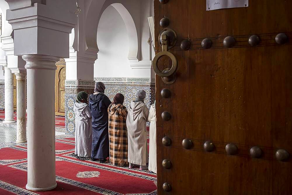 Women praying, Courtyard, Zaouia (tomb) of Moulay Idriss II, medina, Fez. Morocco