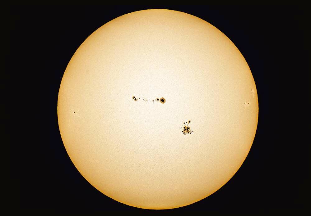 Particularly large groups of sunspots on the Sun on September 4, 2017. The group at bottom is AR 2673, the group at top is 2674. The small spot at left on the emerging limb is AR 2677, while the groups disappearing at right are AR 2675 (top) and AR 2776.