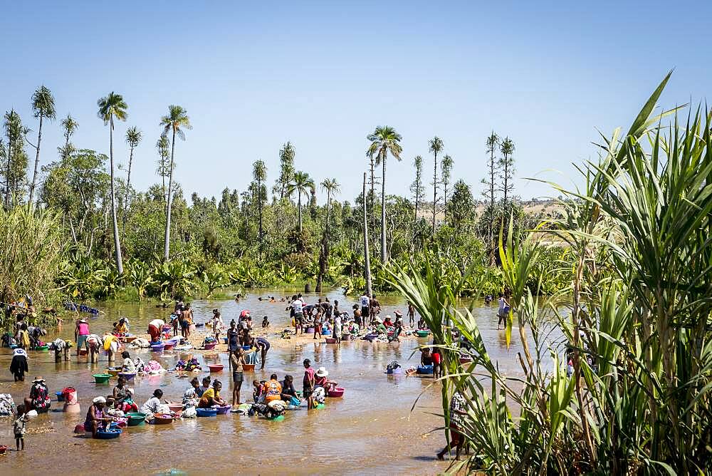 People washing clothes in the river of Ilakaka village, Madagascar