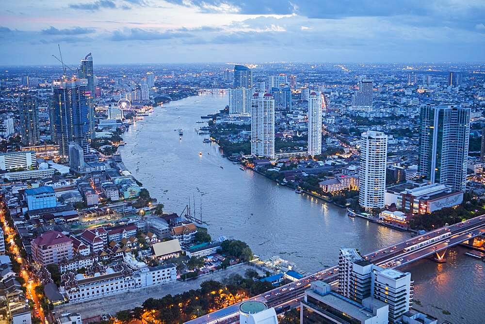 Skyline and Chao phraya River at night, downtown, Bangkok, Thailand