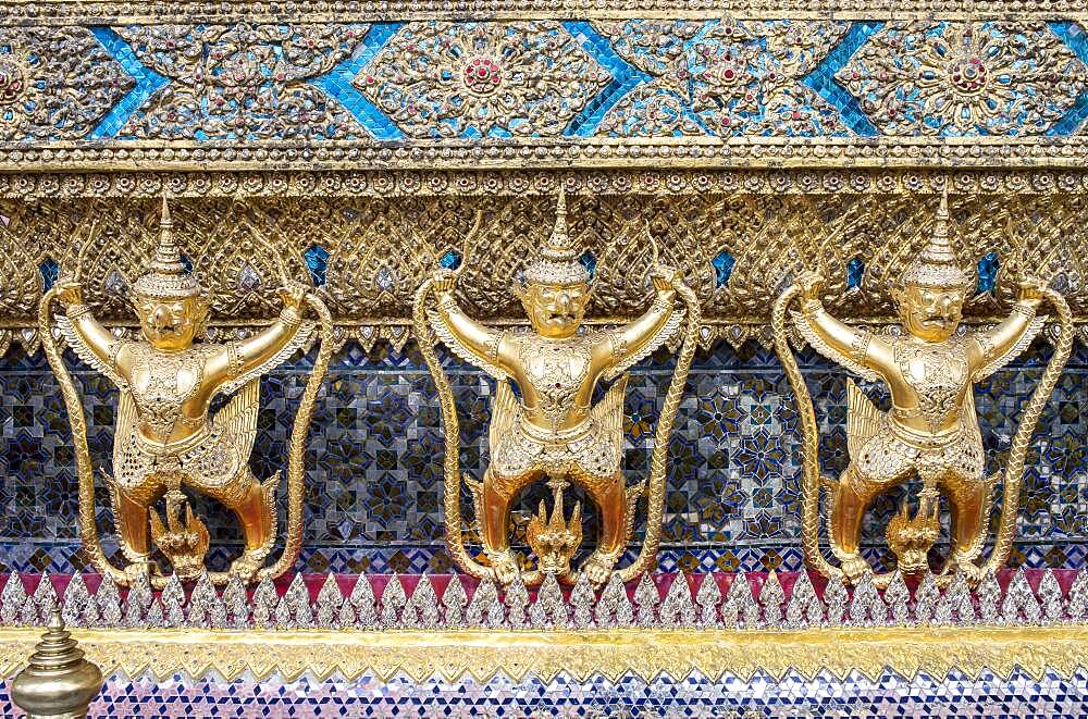 Gold Kinnara statues, Temple of the emerald Buddha, Wat Phra Kaeo temple, Grand Palace, Bangkok, Thailand