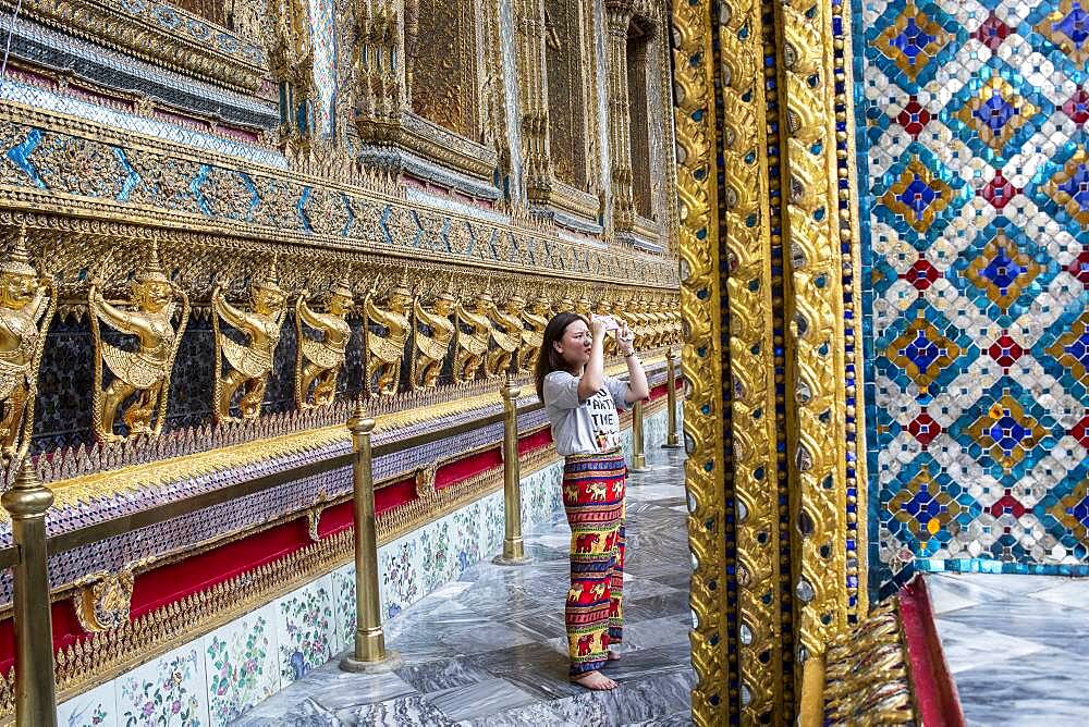 Tourist, at Emerald Buddha Wat Phra Kaeo temple, Grand Palace, Bangkok, Thailand