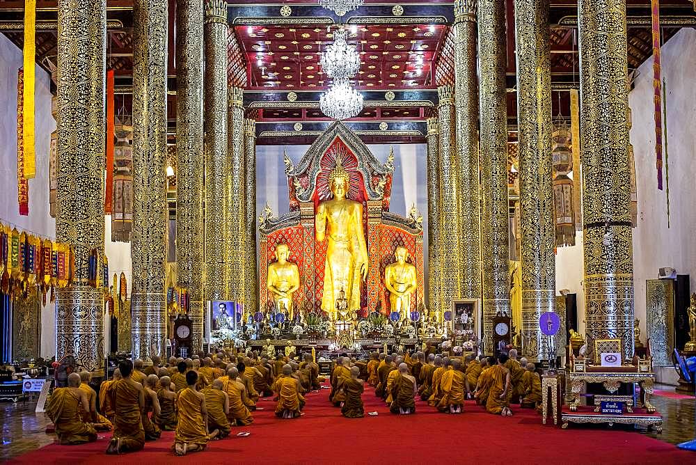 Monks praying, in  Wat Chedi Luang temple, Chiang Mai, Thailand