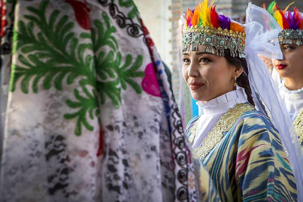 women in traditional dress, for folk dance, dancer, in Rukhobod Mausoleum, Samarkand, Uzbekistan