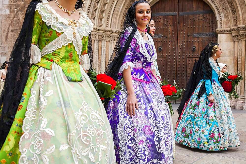 Flower offering parade,People with Floral tributes to `Virgen de los desamparados��, Fallas festival, Plav�a de l��Almoina square,Valencia