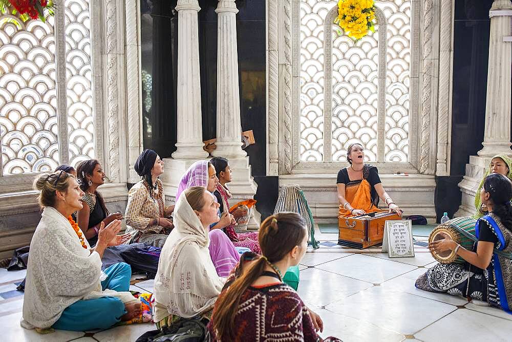 Group of women praying, in ISKCON temple, Sri Krishna Balaram Mandir,Vrindavan,Mathura, Uttar Pradesh, India