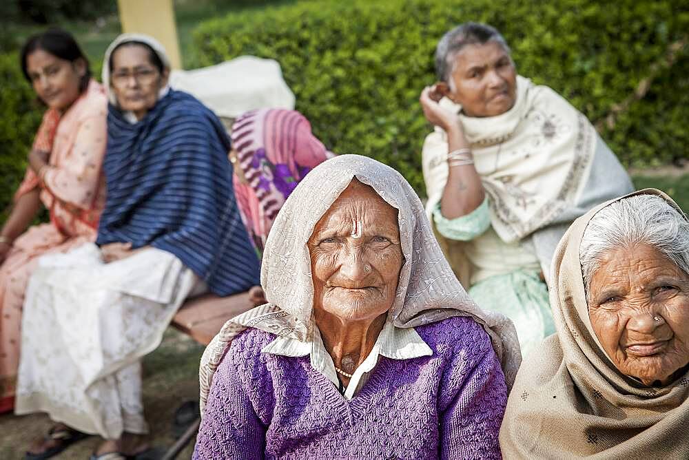 Group of Widows, in Ma Dham ashram for Widows of the NGO Guild for Service, Vrindavan, Mathura district, India