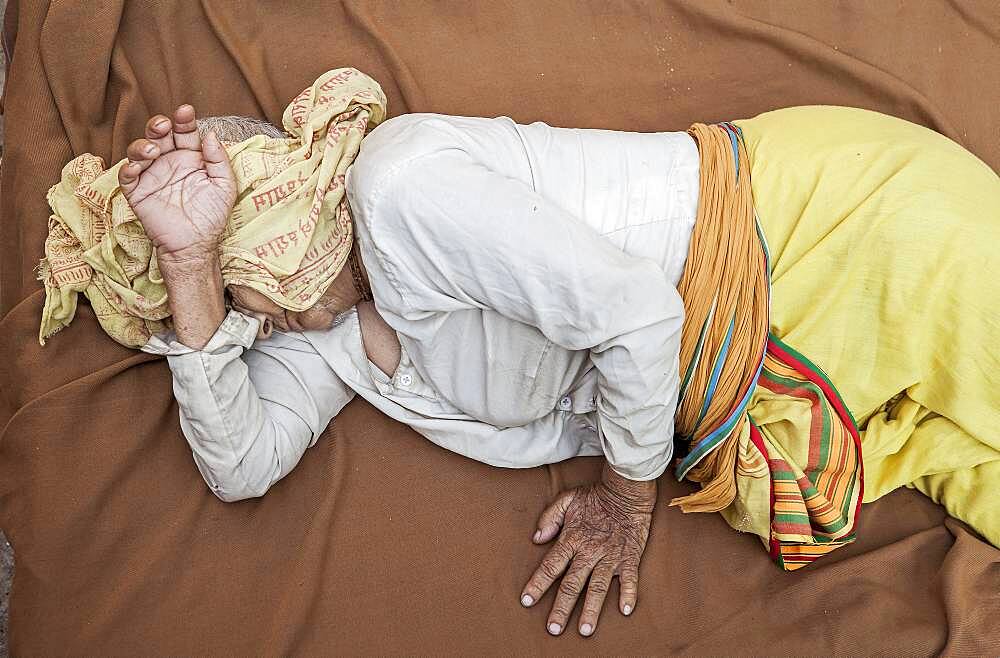 Widow sleeping in the street,homless, Vrindavan, Mathura district, India