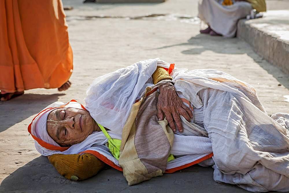 Widow sleeping in the street,homless, Vrindavan, Mathura district, India