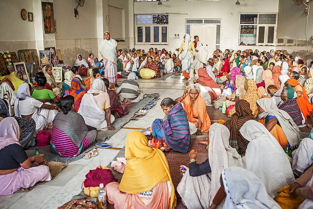 Widows praying in an Balaji ashram, Vrindavan, Mathura district, India