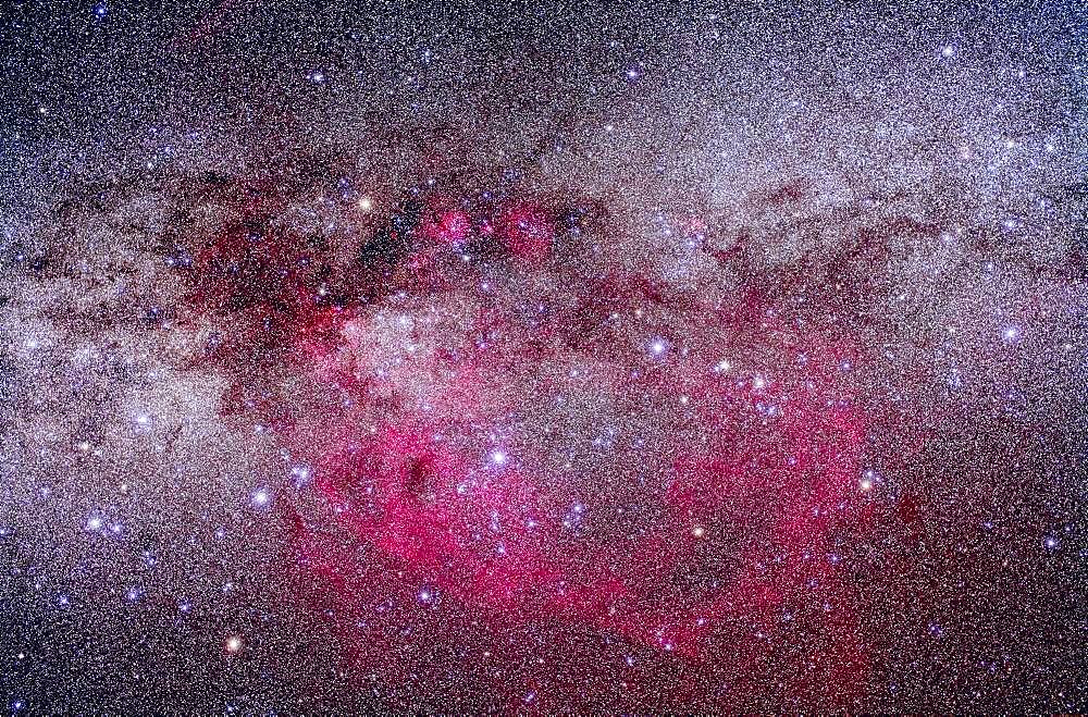 Gum Nebula area of Vela and Puppis. Taken from Atacama Lodge, Chile, March 19, 2010, with modified Canon 5D MkII and Sigma 50mm lens at f/4, for stack of 10 x 6 minute exposures (Mean combined) at ISO 800 plus 2 x 6 minutes with Kenko Softon filter. High contrast boost and Selective Colour adjustments to bring out nebulocity while retaining neutral sky.