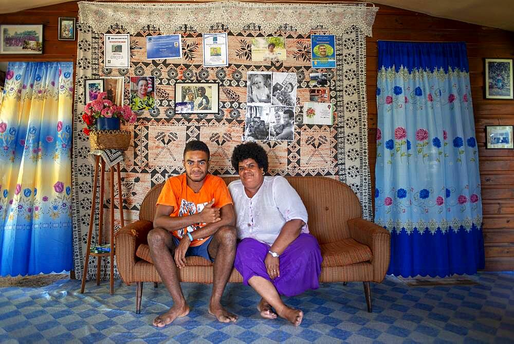 Family inside a house in Solevu island and Yaro island in Malolo Island Mamanucas island group Fiji