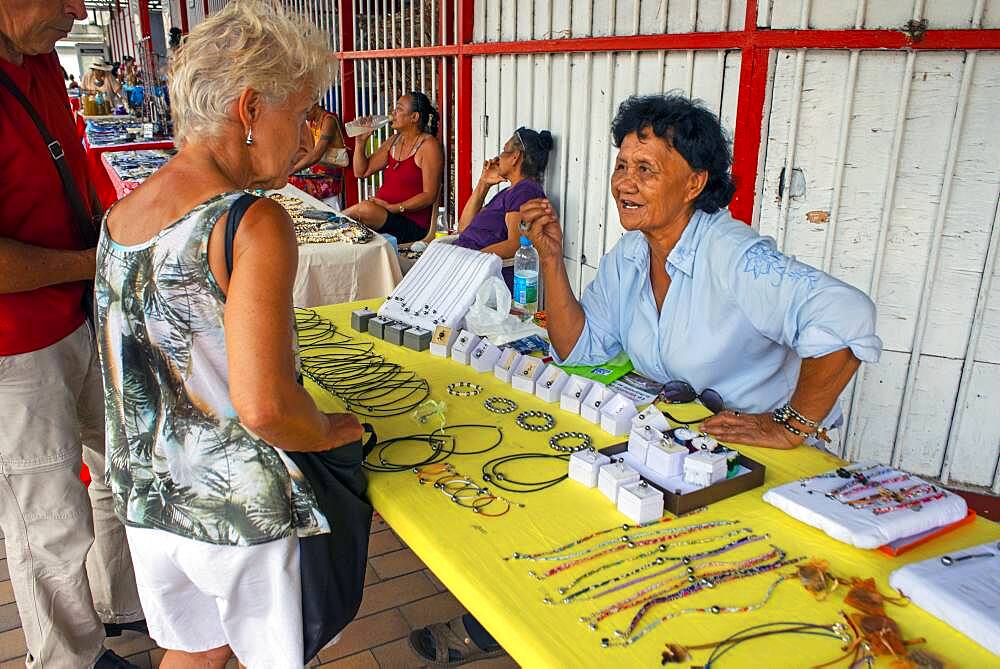 Pearls market in Papeete Tahiti French Polynesia. Tahiti black pearl farming demonstration. Farmer showing black lip oyster to cultivate the precious gem. Cultivation around the islands of French