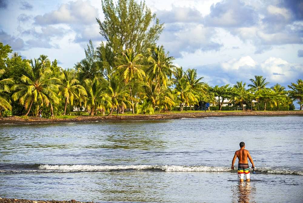 Beach in in front of Tahitian coast.  Papeete Tahiti nui French Polynesia France