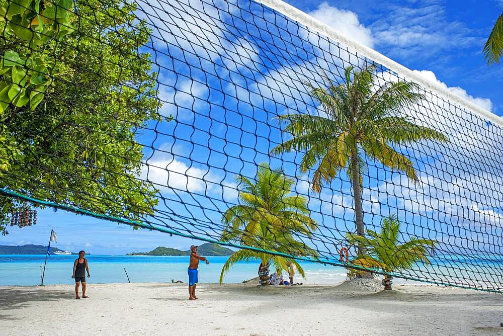 Volley in th beach of motu Tevairoa island, a little islet in the lagoon of Bora Bora, Society Islands, French Polynesia, South Pacific.