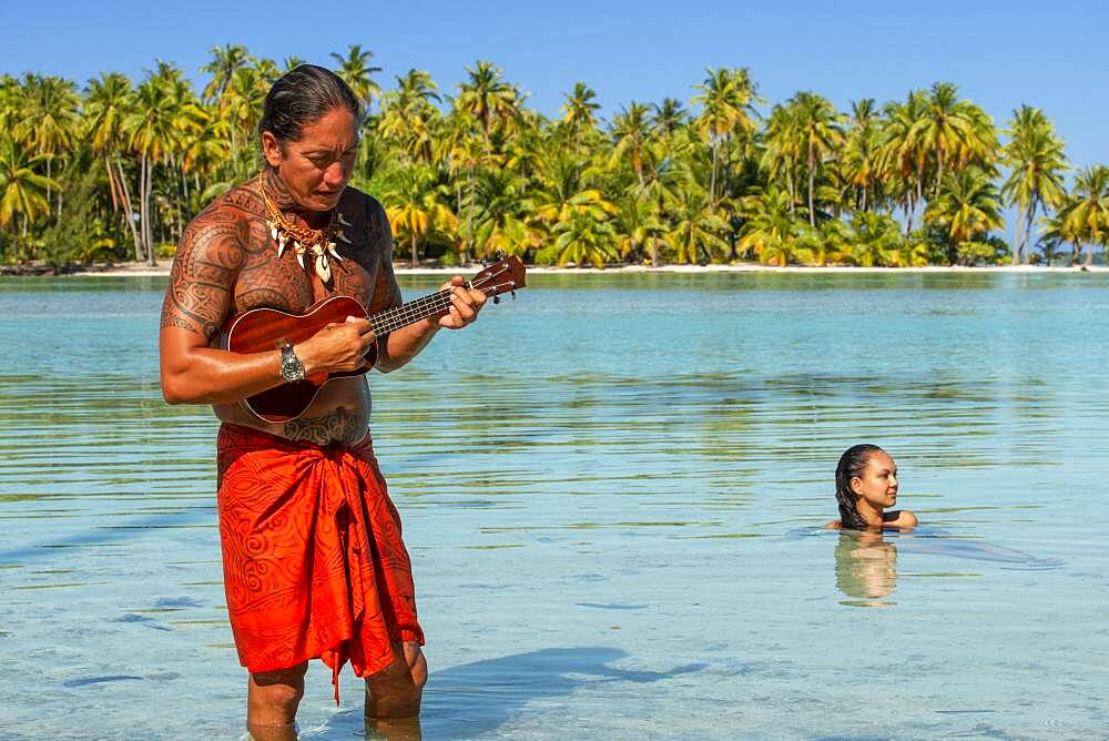 Island of Taha'a, French Polynesia. A local boy plays the ukulele to woo your girl at the Motu Mahana, Taha'a, Society Islands, French Polynesia, South Pacific.