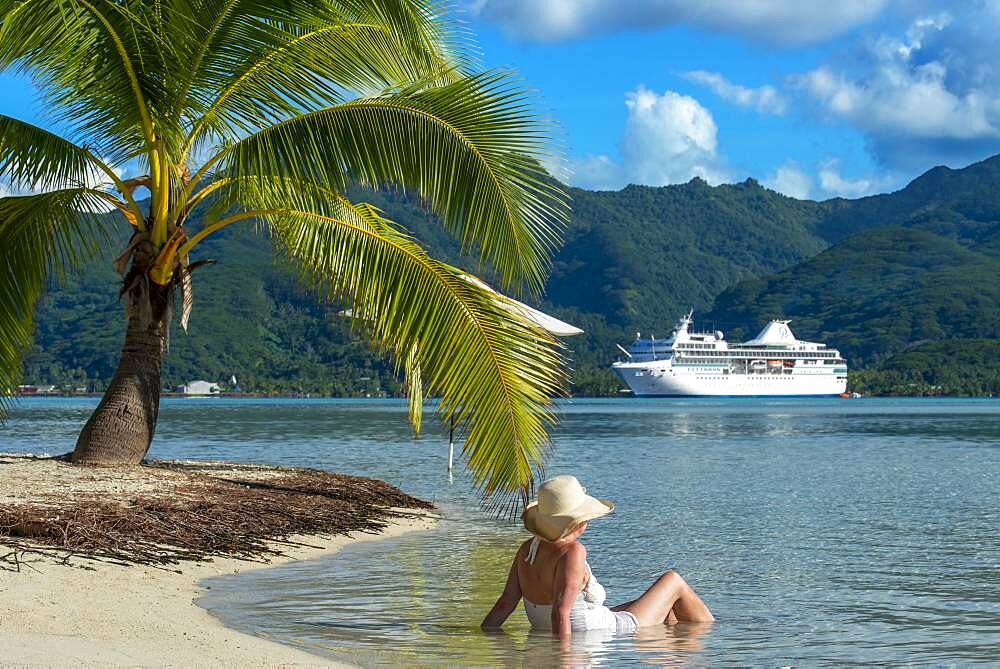 Paul Gauguin docked in the Island of Taha'a, French Polynesia. Motu Mahana palm trees at the beach, Taha'a, Society Islands, French Polynesia, South Pacific.