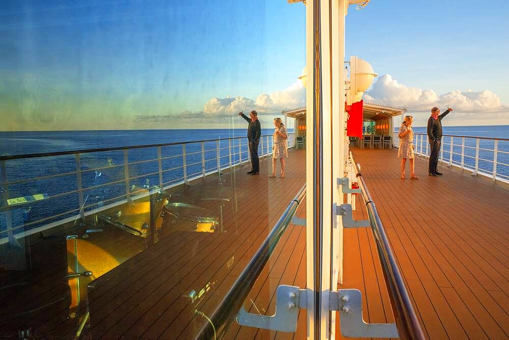 Tourists at the dock of Paul Gauguin cruise, Society Islands, Tuamotus Archipelago, French Polynesia, South Pacific.