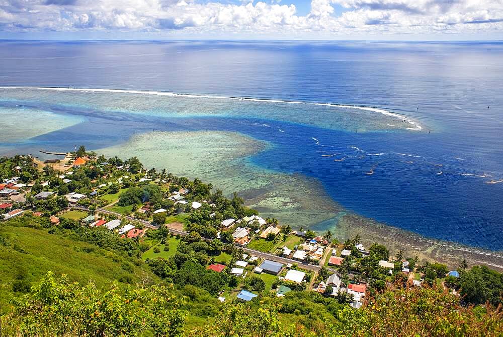 Typical houses, road, and reef see, Moorea island (aerial view), Windward Islands, Society Islands, French Polynesia, Pacific Ocean.