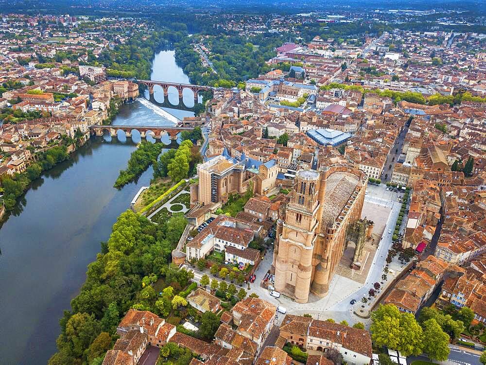 Gothic Saint Cecile Cathedral in Albi town. Pont Vieux bridge and the Church of Notre Dame du Breuil in Tarn village, Languedoc-Roussillon Occitanie Midi Pyrenees France.